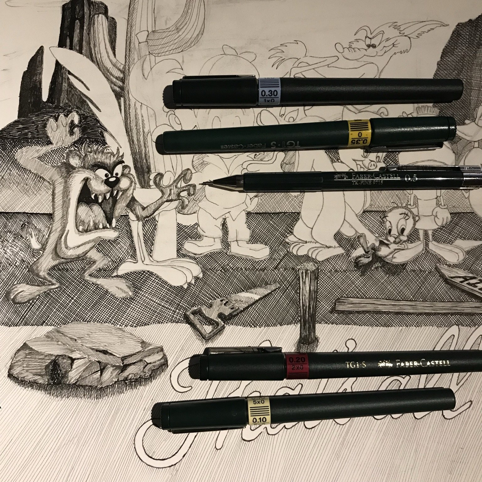 Faber-Castell TG1-S technical pens resting on a detailed pen and ink drawing